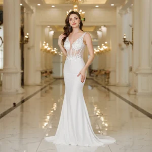 MisShow Elegant Straps White Mermaid Wedding Dresses Lace Pearls Backless V Necklessly Formal Party Gowns Dresses من قسم التحرير الجماعيفساتين زفاف أنيقة بتصميم حورية البحر باللون الأبيض، مزينة بالدانتيل واللؤلؤ، بدون ظهر، بياقة على شكل حرف V، وبدون أكمام، مناسبة للحفلات الرسمية.